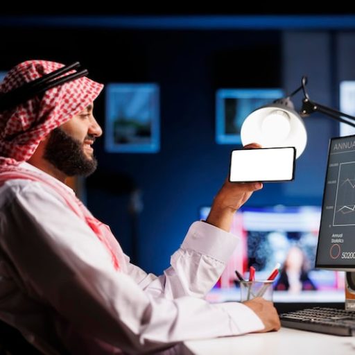 arabic-individual-wearing-traditional-clothing-uses-mobile-phone-office-desk-isolated-white-screen-offers-space-customized-content-advertising-promotional-setting_482257-73146