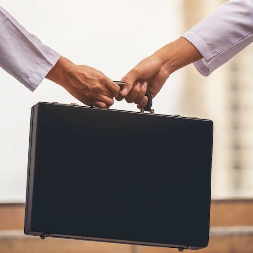 hand-businessman-is-exchanging-very-important-briefcase_33370-150